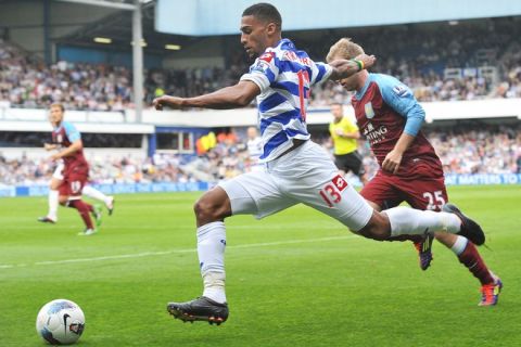 Queens Park Rangers' Armand Traore (L) vies for the ball with Aston Villa's Barry Bannan (R) during the Premiership football match between QPR and Aston Villa at the Loftus Stadium in London, on September 25, 2011. AFP PHOTO/Carl de Souza.

RESTRICTED TO EDITORIAL USE. No use with unauthorized audio, video, data, fixture lists, club/league logos or 'live' services. Online in-match use limited to 45 images, no video emulation. No use in betting, games or single club/league/player publications. (Photo credit should read CARL DE SOUZA/AFP/Getty Images)