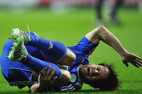 BREMEN, GERMANY - APRIL 29:  Diego of Wolfsburg lays on the pitch after a challenge during the Bundesliga match between SV Werder Bremen and VfL Wolfsburg at Weser Stadium on April 29, 2011 in Bremen, Germany.  (Photo by Stuart Franklin/Bongarts/Getty Images)