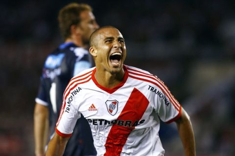 River Plate's new player, French-Argentine David Trezeguet celebrates after scoring the team's third goal against Independiente de Rivadavia, in Buenos Aires, on Febraury 18, 2012. Former France international Trezeguet has agreed terms on a two and a half year deal with Argentine giants River Plate, one of the country's most successful clubs but currently competing in the second division in Argentina's professional leagues after being relegated for the first time in their history last year. River Plate won by 3-0.    AFP PHOTO / Maxi Failla (Photo credit should read Maxi Failla/AFP/Getty Images)