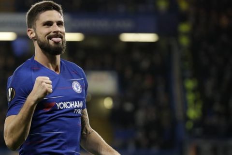 Chelsea's Oliver Giroud celebrates after scoring a goal during the Europa League Group L soccer match between Chelsea and PAOK at Stamford Bridge stadium, in London, Thursday, Nov. 29, 2018. (AP Photo/Matt Dunham)