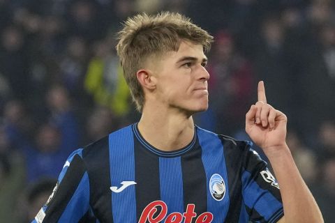 Atalanta's Charles De Ketelaere celebrates after he scored his side's first goal during the Champions League opening phase soccer match between Atalanta and Real Madrid at the Bergamo's stadium, in Bergamo, Italy, Tuesday, Dec. 10, 2024. (AP Photo/Antonio Calanni)