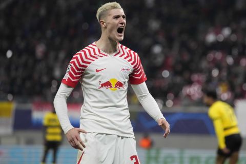 Leipzig's Benjamin Sesko celebrates after scoring his side's first goal during the group G Champions League soccer match between RB Leipzig and Young Boys Bern at the Red Bull arena stadium in Leipzig, Germany, Wednesday, Dec. 13, 2023. (AP Photo/Matthias Schrader)