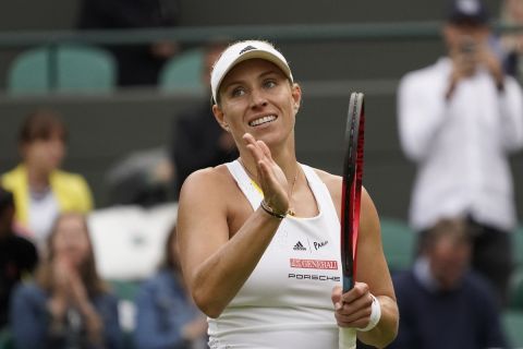 FILE - Germany's Angelique Kerber gestures, after defeating France's Kristina Mladenovic during their women's singles tennis match on day one of the Wimbledon tennis championships in London, Monday, June 27, 2022. Three-time Grand Slam champion Angelique Kerber announced Thursday, July 25, 2024 that she will retire after the Paris Olympics. (AP Photo/Alberto Pezzali, File)