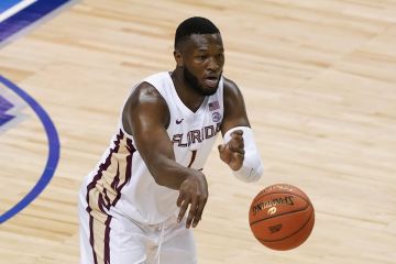 Florida State forward RaiQuan Gray (1) passes the ball during the first half of an NCAA college basketball Championship game against George Tech at the Atlantic Coast Conference tournament in Greensboro, N.C., Saturday, March 13, 2021. (AP Photo/Gerry Broome)