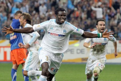 Marseille's Nigerian defender Taiwo Taye Ismaila celebrates after Marseille won the French League Cup final football match Montpellier versus Marseille on April 23, 2011 at the Stade de France in Saint-Denis, north of Paris. Marseille won 1-0. AFP PHOTO / THOMAS COEX (Photo credit should read THOMAS COEX/AFP/Getty Images)