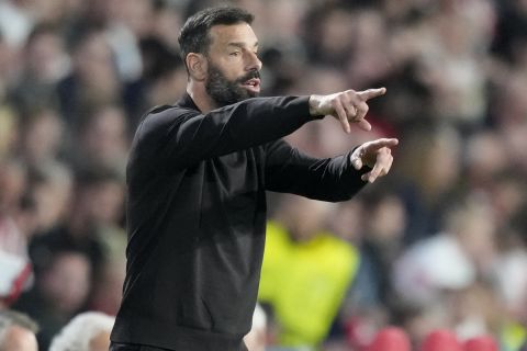 PSV's head coach Ruud van Nistelrooy gestures during the Europa League group A soccer match between PSV and Arsenal at the Philips stadium in Eindhoven, Netherlands, Thursday, Oct. 27, 2022. (AP Photo/Peter Dejong)