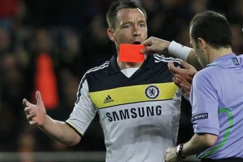 Chelsea's John Terry, left, gets a red card from the referee during a Champions League second leg semifinal soccer match against Barcelona at Camp Nou stadium, in Barcelona, Spain, Tuesday, April 24, 2012. Chelsea drew 2-2 with Barcelona to win the match 3-2 on aggregate. (AP Photo/Andres Kudacki)