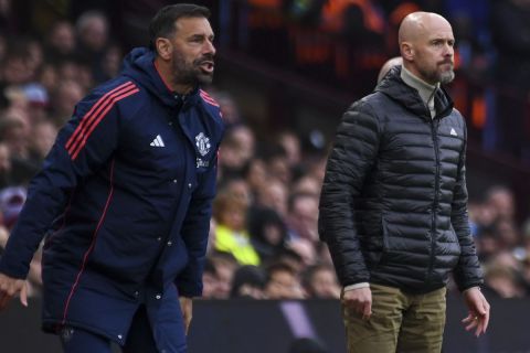 Manchester United's head coach Erik ten Hag, right, and Manchester United's assistant manager Ruud van Nistelrooy react during the English Premier League soccer match between Aston Villa and Manchester United, at Villa Park in Birmingham, England, Sunday, Oct. 6, 2024. (AP Photo/Rui Vieira)