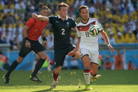 RIO DE JANEIRO, BRAZIL - JULY 4 :  Germany's Mario Goetze (19) challenges Mathieu Debuchy (2) of France during the 2014 FIFA World Cup Brazil Quarter Final match at Maracana in Rio de Janeiro, Brazil on July 4, 2014. (Photo by Metin Pala/Anadolu Agency/Getty Images)