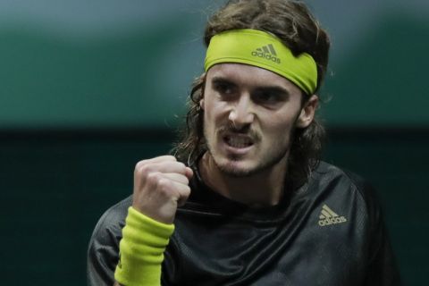 Greece's Stefanos Tsitsipas clenches his fist after scoring a point against Poland's Hubert Hurkacz in their second round men's singles match of the ABN AMRO world tennis tournament at Ahoy Arena in Rotterdam, Netherlands, Thursday, March 4, 2021. (AP Photo/Peter Dejong)