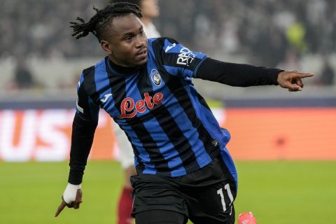 Atalanta's Ademola Lookman celebrates after scoring his side's opening goal during the Champions League opening phase soccer match between Stuttgart and Atalanta at the Stuttgart Arena in Stuttgart, Germany, Wednesday, Nov. 6, 2024. (AP Photo/Michael Probst)