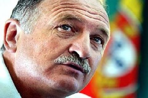 ** TO GO WITH EURO 2004 PREVIEW PACKAGE ** Portugal's Brazilian coach Luis Felipe Scolari during a news conference in June 2003 in Lisbon, Portugal. In the background the Portuguese national flag. (AP Photo/Armando Franca)