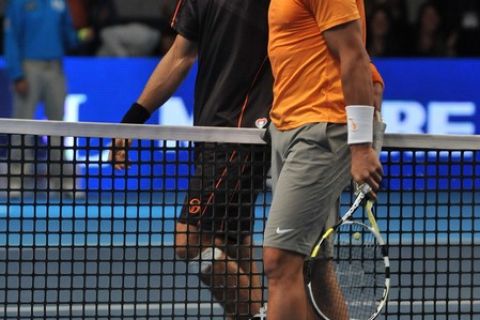 Serbian tennis player Novak Djokovic (L) walks alongside with Rafael Nadal (R) of Spain at the end of an exhibition match at El Campin Coliseum in Bogota, Colombia, on March 21, 2011. AFP PHOTO / Guillermo Legaria (Photo credit should read GUILLERMO LEGARIA/AFP/Getty Images)