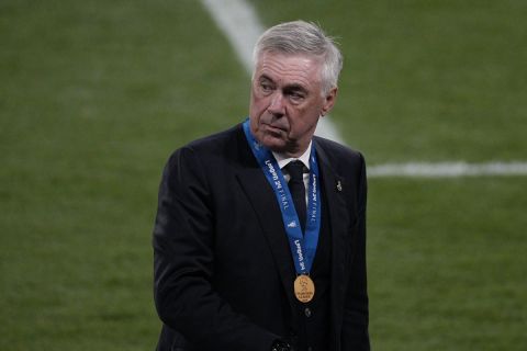 Real Madrid's head coach Carlo Ancelotti walks on the field after the Champions League final soccer match between Borussia Dortmund and Real Madrid at Wembley stadium in London, Saturday, June 1, 2024. Real Madrid won 2-0. (AP Photo/Dave Shopland)