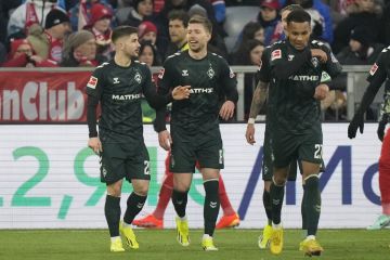 Bremen's Mitchell Weiser, centre, celebrates after scoring his side's opening goal during the German Bundesliga soccer match between Bayern Munich and Werder Bremen at the Allianz Arena stadium in Munich, Germany, Sunday, Jan. 21, 2024. (AP Photo/Matthias Schrader)