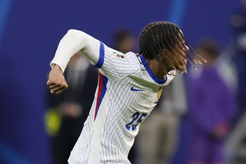 Bradley Barcola of France celebrates after scoring during a penalty shootou against Portugal during a quarter final match at the Euro 2024 soccer tournament in Hamburg, Germany, Friday, July 5, 2024. (AP Photo/Hassan Ammar)