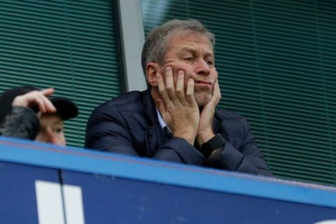 Chelsea owner Roman Abramovich sits in his box before the English Premier League soccer match between Chelsea and Sunderland at Stamford Bridge stadium in London, Saturday, Dec. 19, 2015. (AP Photo/Matt Dunham)