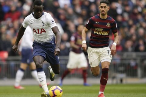 Tottenham's Davinson Sanchez, left, and Newcastle's Ayoze Perez vie for the ball during the English Premier League soccer match between Tottenham Hotspur and Newcastle at Wembley Stadium in London, Saturday, Feb. 2, 2019.(AP Photo/Tim Ireland)