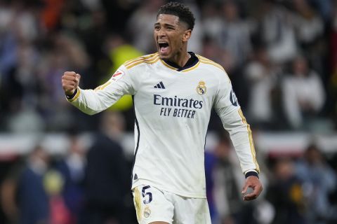 FILE - Real Madrid's Jude Bellingham celebrates after scoring his side's third goal during the Spanish La Liga soccer match between Real Madrid and Barcelona at the Santiago Bernabeu stadium in Madrid, Spain, Sunday, April 21, 2024. (AP Photo/Manu Fernandez, File)