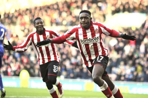 Sunderland's English striker Danny Welbeck (R) celebrates with Ghanaian striker Asamoah Gyan (L) after  scoring the opening goal of the English Premier League football match between Sunderland and Bolton Wanderers at the Stadium of Light, Sunderland, north-east England, on December 18, 2010. AFP PHOTO/GRAHAM STUARTFOR EDITORIAL USE ONLY Additional licence required for any commercial/promotional use or use on TV or internet (except identical online version of newspaper) of Premier League/Football League photos. Tel DataCo +44 207 2981656. Do not alter/modify photo. (Photo credit should read GRAHAM STUART/AFP/Getty Images)