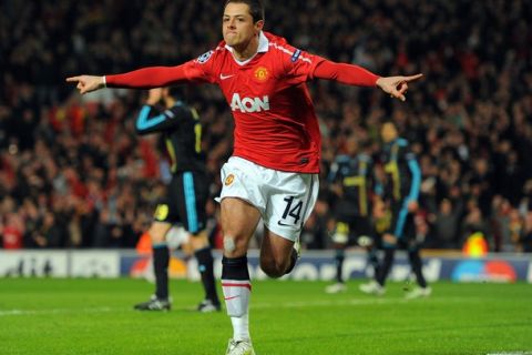 Manchester United's Mexican forward Javier Hernandez celebrates scoring against Marseille during their UEFA Champions League round of 16, second leg football match at Old Trafford in Manchester, north-west England, on March 15, 2011.  AFP PHOTO/ANDREW YATES (Photo credit should read ANDREW YATES/AFP/Getty Images)