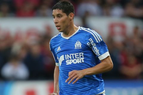 Marseille's midfielder Abdelaziz Barrada runs with the ball on the field during his French League One soccer match against Guingamp at the Roudourou stadium in Guingamp, western France, Friday, Aug. 28, 2015. (AP Photo/David Vincent)