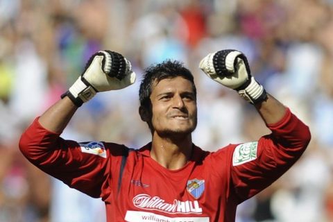 Malaga's goalkeeper Gustavo Adolfo Munua celebrates after his teammate Navil Baha scored against Atletico de Madrid during their Spanish league football match at La Rosaleda stadium in Malaga, on August, 30, 2009. AFP PHOTO / CRISTINA QUICLER (Photo credit should read CRISTINA QUICLER/AFP/Getty Images)