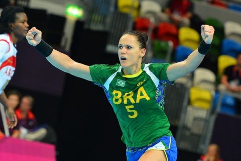 Brazil's pivot Daniela Piedade reacts after a goal during the women's preliminary Group A handball match Brazil vs Angola for the London 2012 Olympics Games on August 5, 2012 at the Copper Box hall in London. Brazil won 29-26.    AFP PHOTO/ MIGUEL MEDINA        (Photo credit should read MIGUEL MEDINA/AFP/GettyImages)