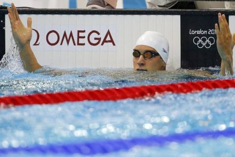 Matthew Grevers of the U.S. reacts after winning his men's 100m backstroke heat during the London 2012 Olympic Games at the Aquatics Centre July 29, 2012. REUTERS/Jorge Silva (BRITAIN  - Tags: SPORT OLYMPICS SPORT SWIMMING)  