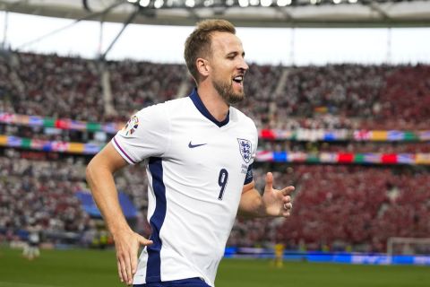 England's Harry Kane celebrates after scoring a goal during a Group C match between Denmark and England at the Euro 2024 soccer tournament in Frankfurt, Germany, Thursday, June 20, 2024. (AP Photo/Themba Hadebe)