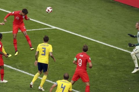 England's Dele Alli, 3rd right, scores his side's second goal during the quarterfinal match between Sweden and England at the 2018 soccer World Cup in the Samara Arena, in Samara, Russia, Saturday, July 7, 2018. (AP Photo/Thanassis Stavrakis)