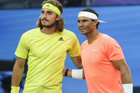 Spain's Rafael Nadal, right, and Greece's Stefanos Tsitsipas pose for a photo ahead of their quarterfinal match at the Australian Open tennis championship in Melbourne, Australia, Wednesday, Feb. 17, 2021.(AP Photo/Hamish Blair)