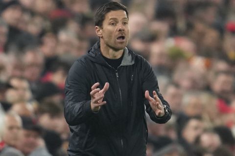 Leverkusen's head coach Xabi Alonso gestures from the touchline during the Champions League opening phase soccer match between Liverpool and Bayer Leverkusen at Anfield in Liverpool, England, Tuesday, Nov. 5, 2024. (AP Photo/Jon Super)