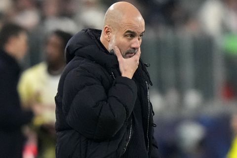 Manchester City's head coach Pep Guardiola reacts during the Champions League, opening phase soccer match between Juventus and Manchester City at the Allianz stadium in Turin, Italy, Tuesday, Wednesday, Dec.11, 2024. (AP Photo/Luca Bruno)