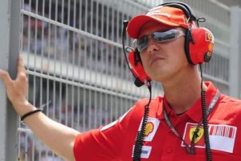 FILE - In this Sunday, May 10, 2009 file photo, former German Ferrari driver Michael Schumacher watches the Spanish Formula One Grand Prix from the pits at the Circuit de Catalunya racetrack, in Montmelo, near Barcelona, Spain. Michael Schumacher called off a much-anticipated Formula One comeback as a result of injuries sustained in a motorcycling accident earlier this year. Schumacher said Tuesday, Aug. 11, 2009 he informed top Ferrari officials Monday evening that "unfortunately I'm not able to step in for Felipe" Massa, whom he was set to replace temporarily. (AP Photo/Manu Fernandez, Pool, File)