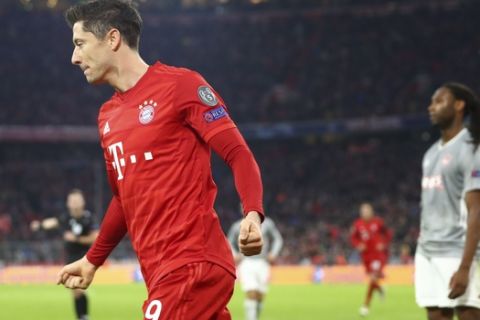 Bayern's Robert Lewandowski celebrates after scoring the opening goal of his team during the Champions League group B soccer match between Bayern Munich and Olympiakos in Munich, Germany, Wednesday, Nov. 6, 2019. (AP Photo/Matthias Schrader)