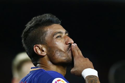 FC Barcelona's Paulinho celebrates after scoring during the Spanish La Liga soccer match between FC Barcelona and Deportivo Coruna at the Camp Nou stadium in Barcelona, Spain, Sunday, Dec. 17, 2017. (AP Photo/Manu Fernandez)