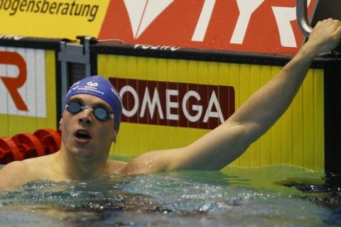 Germany's Paul Biedermann reacts after winning the men's 200m freestyle finals at the German Swimming Championships in Berlin June 5, 2011. REUTERS/Wolfgang Rattay (GERMANY - Tags: SPORT SWIMMING)