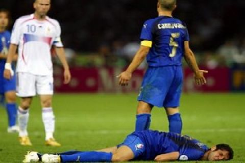 Italy's Marco Materazzi on the turf after Zinedine Zidane's headbutt to the chest.