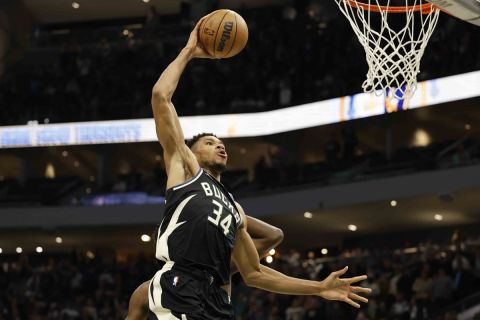 Milwaukee Bucks forward Giannis Antetokounmpo (34) dunks against the Atlanta Hawks during the second half of an NBA basketball game Saturday, Oct. 29, 2022, in Milwaukee. The Bucks won 123-115. (AP Photo/Jeffrey Phelps)