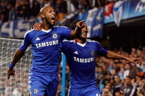 LONDON, ENGLAND - SEPTEMBER 28 :   Nicolas Anelka (L) of Chelsea celebrates his goal from the penalty spot with team-mate Florent Malouda during the UEFA Champions League Group F match between Chelsea and Marseille at Stamford Bridge on September 28, 2010 in London, England.  (Photo by Jan Kruger/Getty Images)