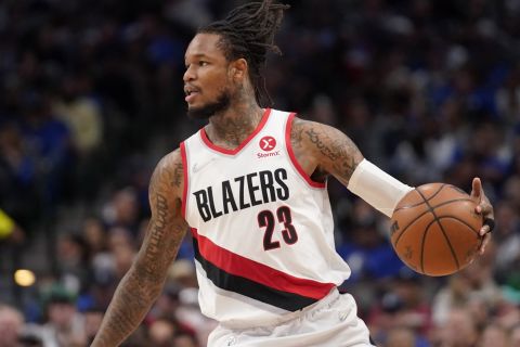 Portland Trail Blazers guard Ben McLemore works against the Dallas Mavericks during an NBA basketball game Friday, April 8, 2022, in Dallas. (AP Photo/Tony Gutierrez)