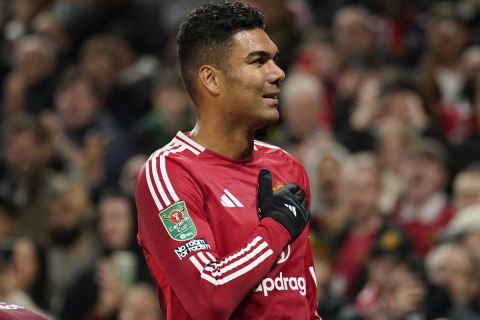 Manchester United's Casemiro celebrates after scoring his side's opening goal during the English League Cup soccer match between Manchester United and Leicester City at the Old Trafford stadium in Manchester, England, Wednesday, Oct. 30, 2024. (AP Photo/Dave Thompson)