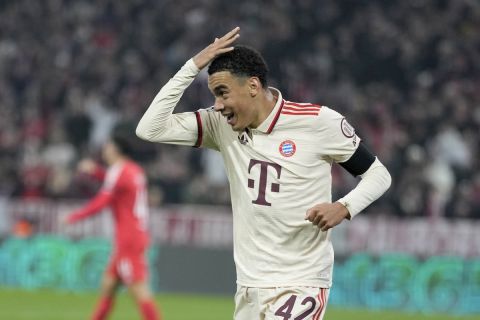 Bayern's Jamal Musiala celebrates after scoring the opening goal during the Champions League opening phase soccer match between Bayern Munich and SL Benfica, in Munich, Germany, Wednesday, Nov. 6, 2024. (AP Photo/Matthias Schrader)