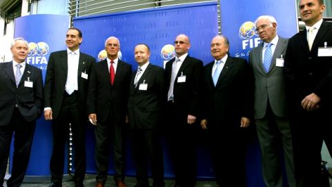 From left: Swiss national soccer coach Jakob "Koebi" Kuhn, Ambogan Lufti, General Secretary Turkey, German Franz Beckenbauer, president of the Local Organising Committee of the 2006 FIFA World Cup Organising Committee Germany, Petr Fousek, General Secretary Czech Republic, Guttorm Dilling, Team administrator Norway, FIFA president Joseph. S. Blatter, Luis Aragones, National Team Coach Spain, and Dusan Galis, National Team Coach Slovakia, pose after the FIFA draw of the pairings for the three play-off matches of the 2006 FIFA World Cup in Germany at FIFA headquarters in Zurich, Switzerland, Friday, Oct. 14, 2005. The Czech Republic, Norway, Slovakia, Spain, Switzerland and Turkey sealed their place in the play-off draw, after coming second in their group on Oct. 12 in the qualifying competition of the World Cup. (KEYSTONE/Walter Bieri)