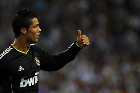 Real Madrid's Portuguese forward Cristiano Ronaldo gives the thumb up after scoring against Malaga FC during their Spanish league football match Malaga against Real Madrid at Rosaleda stadium on October 16,  2010 in Malaga.     AFP PHOTO/ JORGE GUERRERO (Photo credit should read Jorge Guerrero/AFP/Getty Images)