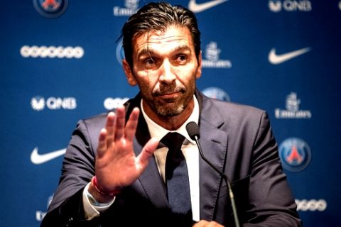 PSG's new signing goalkeeper Gianluigi Buffon waves during a press conference held at the Parc des Princes stadium in Paris, as part of his official presentation, Monday, July 9, 2018. Free agent Gianluigi Buffon signed for Paris Saint-Germain on Friday. The veteran goalkeeper penned a one-year deal at the French champion with the option for an additional season. (AP Photo/Jean-Francois Badias)