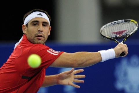 Marcos Baghdatis of Cyprus plays a shot against Jurgen Melzer of Austria during their mens quarter-final match of the ATP Malaysia Open tennis tournament in Kuala Lumpur on September 30, 2011. AFP PHOTO / Saeed KHAN (Photo credit should read SAEED KHAN/AFP/Getty Images)