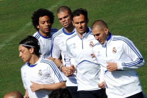 (FromL) Real Madrid's German midfielder Mesut Ozil, Brazilian defender Marcelo, Portuguese defender Pepe, Portuguese defender Ricardo Alberto Carvalho and French forward Karim Benzema take part in a training session in Madrid on April 12, 2011, on the eve of the Champions League quarter-final second leg football match against Tottenham Hotspur. AFP PHOTO / DOMINIQUE FAGET (Photo credit should read DOMINIQUE FAGET/AFP/Getty Images)