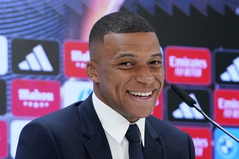 Kylian Mbappe, of France, smiles during a news conference after being presented to fans as a new Real Madrid player at the Santiago Bernabeu stadium in Madrid, Tuesday, July 16, 2024. (AP Photo/Andrea Comas)